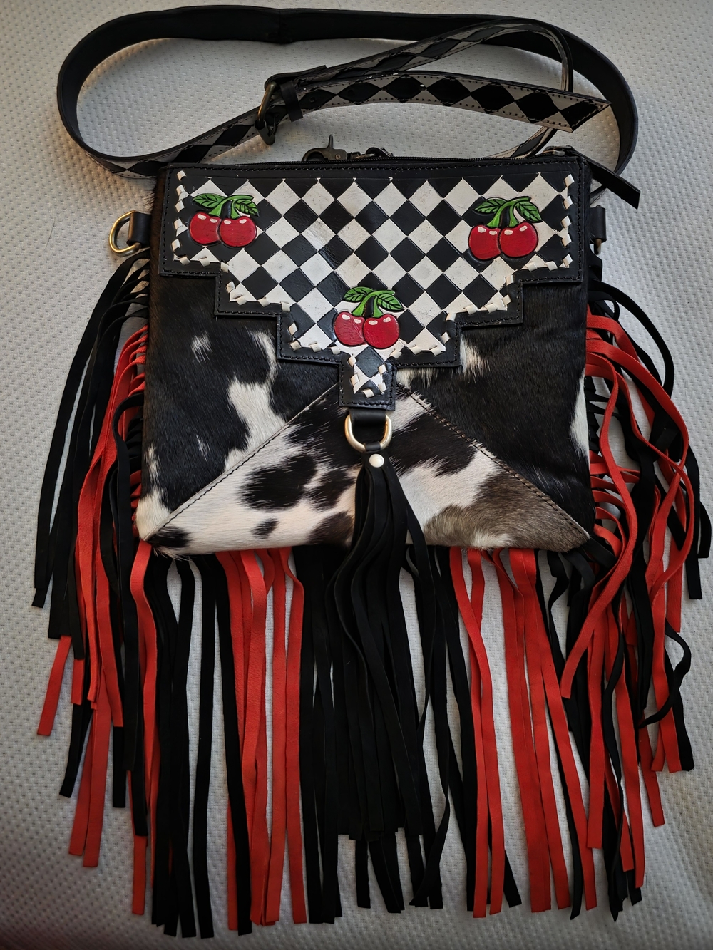 Black & White Cowhide Fringe Crossbody Bag with Cherry Accents